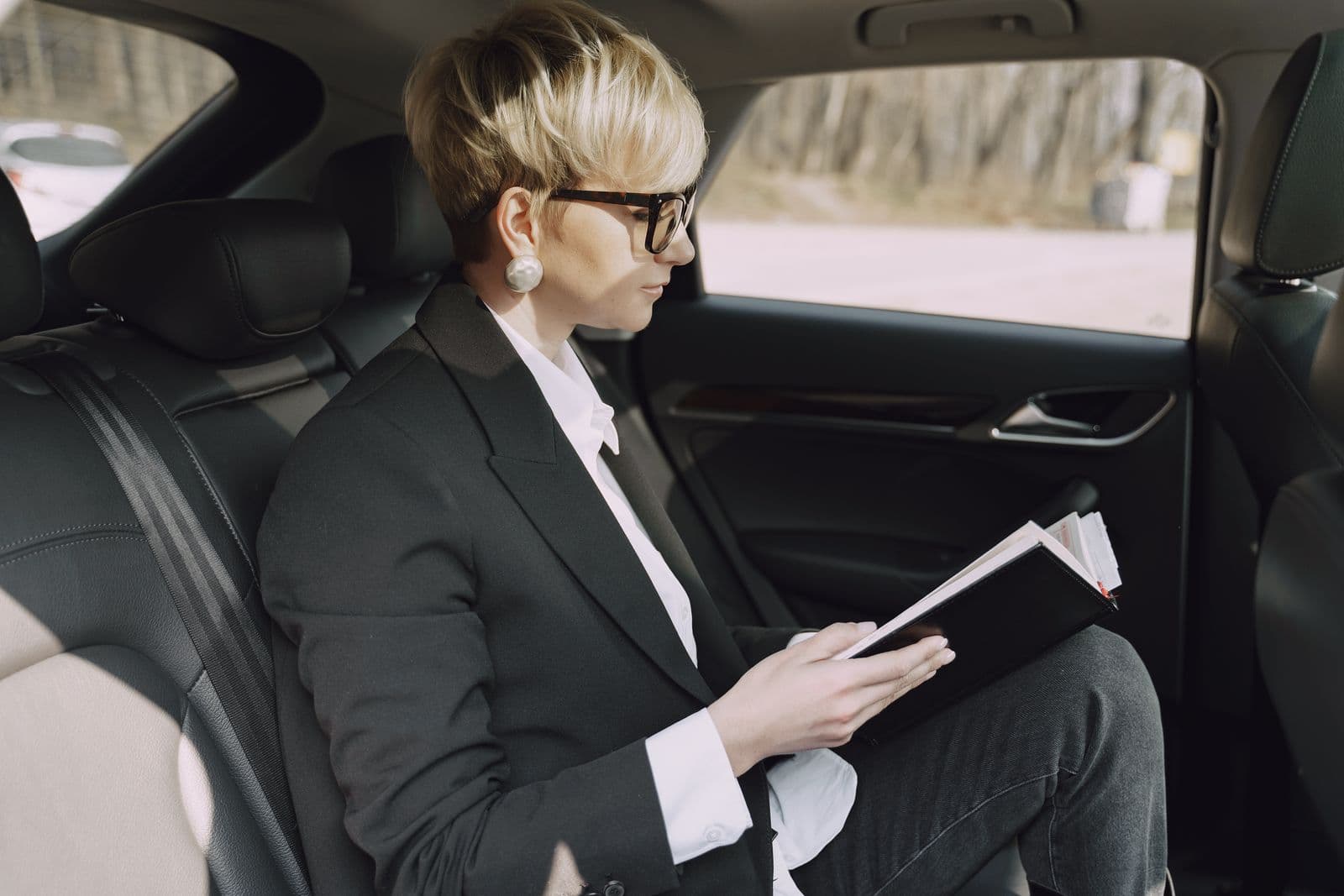 A business traveller working in the back seat of an Urvo ride