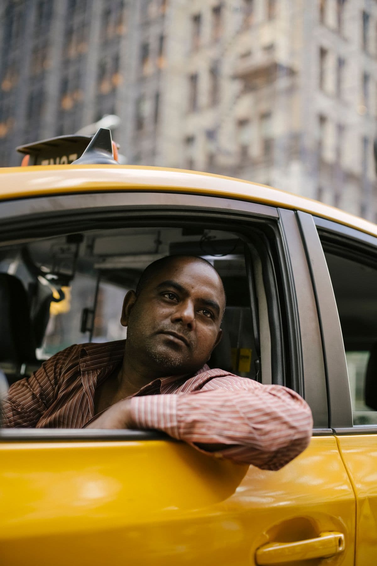 A Flito driver in their car