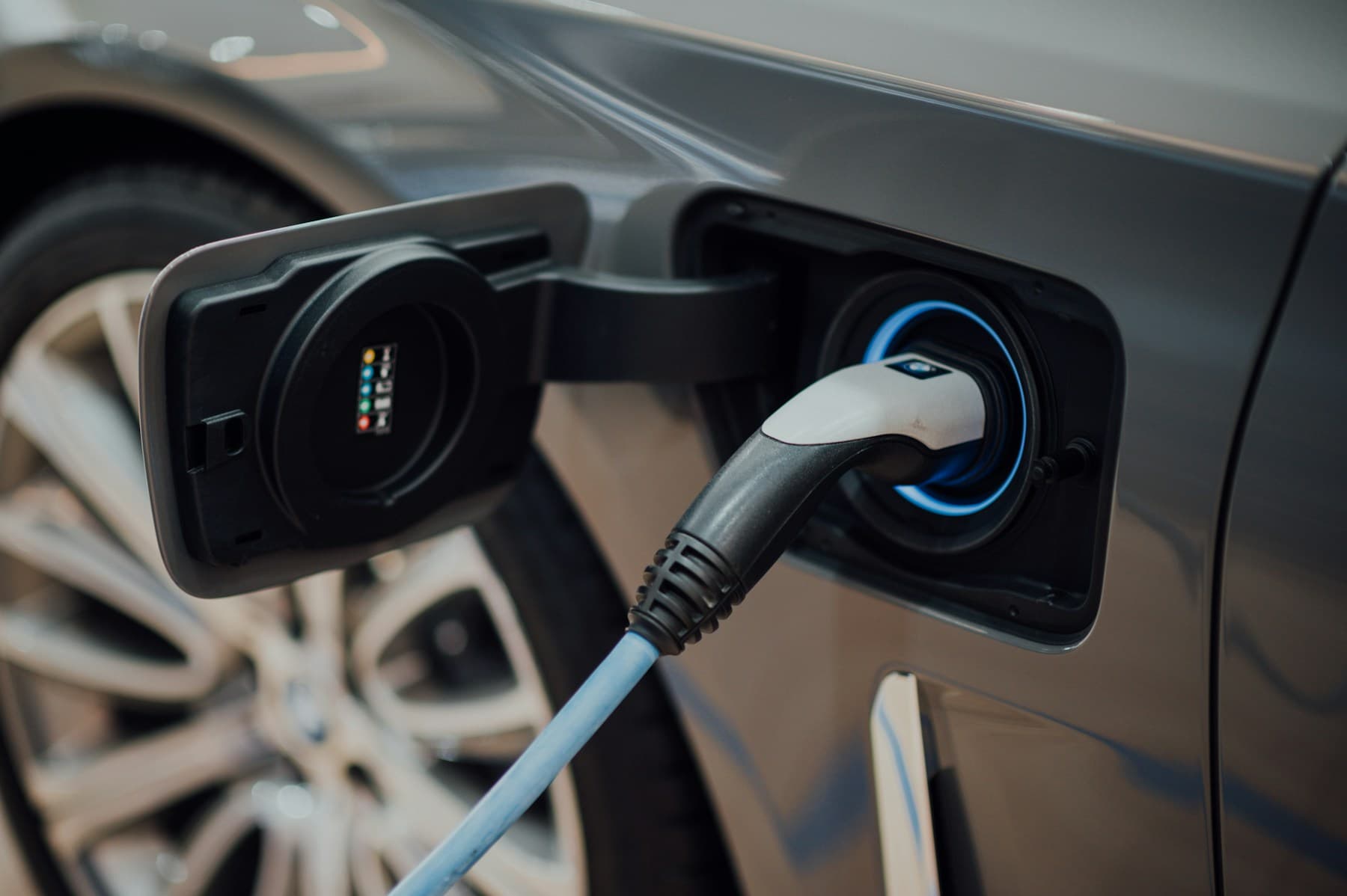 An electric vehicle connected to a charging point